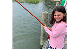 Abigail having a good time fishing